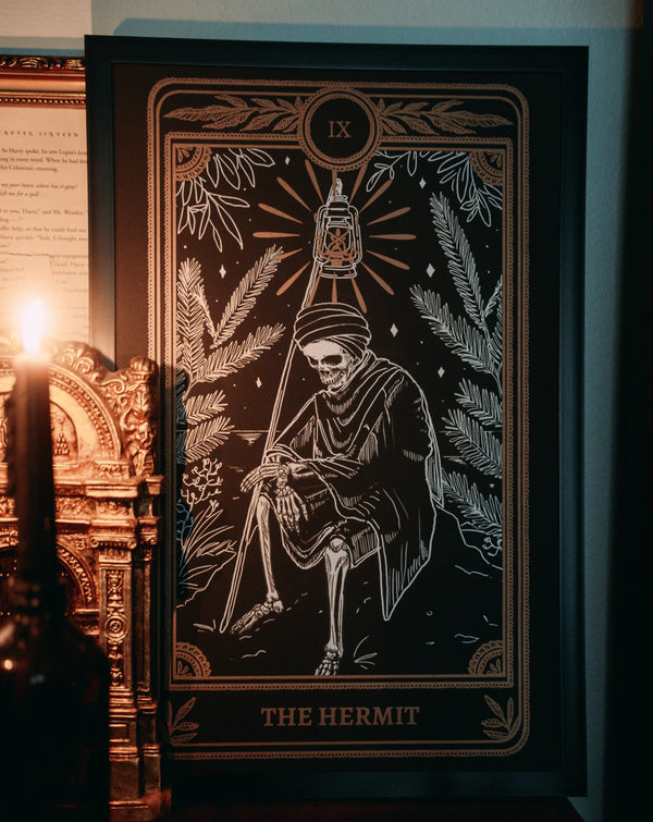 art print of the Hermit tarot card from the Marigold Tarot deck by Amrit Brar and 13th Press with jaw bone and candle light. Wall art, framed art, home decor