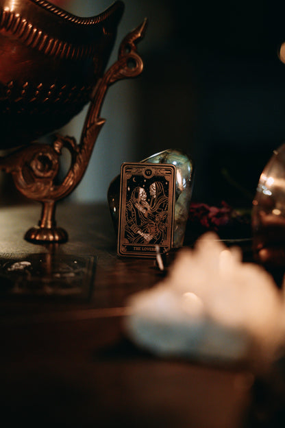 the lovers black, gold, and white metal hard enamel pin design from the Marigold Tarot deck by Amrit Brar and 13th Press