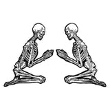 metal hard enamel pin set of two skeletons in prayer position designed by Amrit Brar and 13th Press