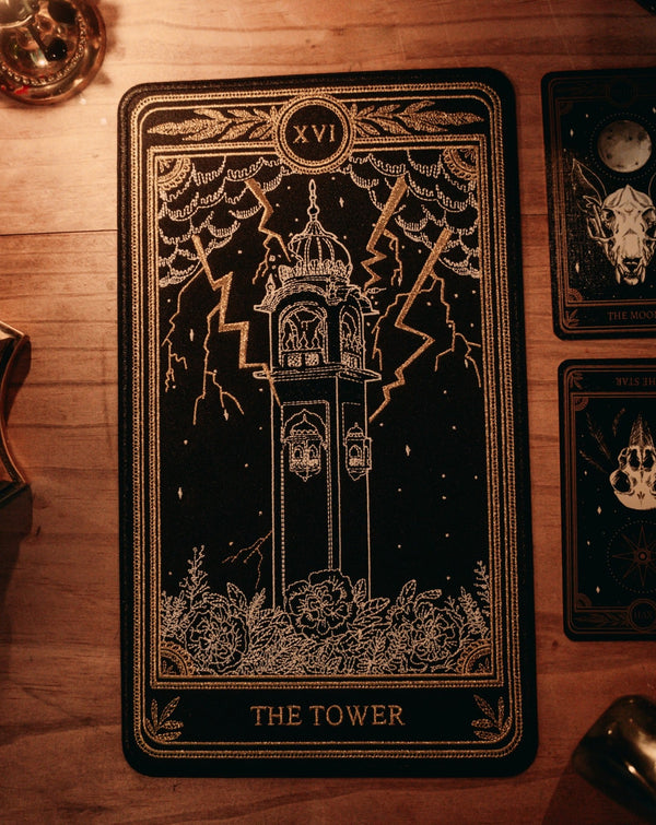 the tower tarot card patch in white, gold, and black thread design from the Marigold Tarot deck by Amrit Brar and 13th Press.