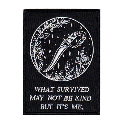 black and white embroidered iron-on patch with dagger and foliage designed by Amrit Brar and 13th Press. Iron-on backing and machine embroidered design.